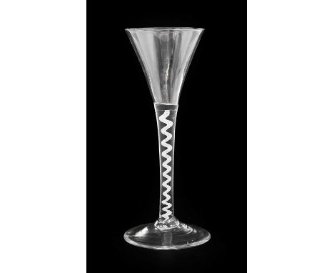 A Wine Glass, circa 1750, the drawn trumpet bowl on an opaque twist stem17.5cm highNo chips, cracks or re polishing. Some lig