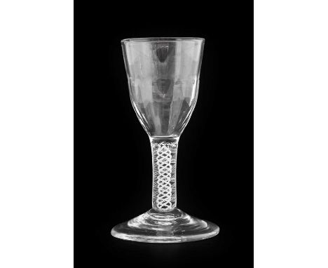 A Dram Glass, circa 1750, the semi-fluted ogee bowl on an opaque twist stem12cm highSmall chip to the underside rim of the fo