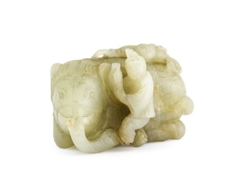 A Chinese Carved Pale Celadon Jade Carving "Washing the Sacred Elephant", 18th/19th century, the recumbent elephant with two 