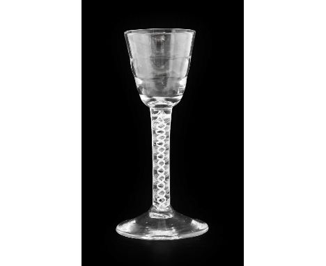 A "Lynn" Wine Glass, circa 1760, the ribbed rounded funnel bowl on an opaque twist stem14cm highNo chips, cracks or re polish