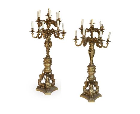 A Pair of French Gilt Bronze Thirteen-Light Candelabra, in Louis XIV style, with fluted sockets, circular sconces, leaf-sheat