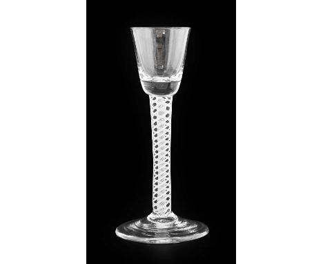 A Cordial Glass, circa 1750, the rounded funnel on an opaque twist stem16.5cm highNo chips, cracks or re polishing. Some ligh
