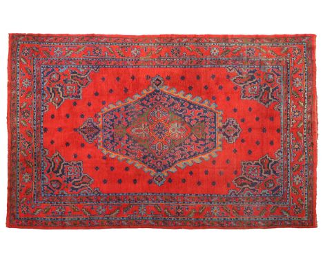Ushak CarpetCentral West Anatolia, circa 1920The blood red field centred by a hexagonal medallion surrounded by stellar motif