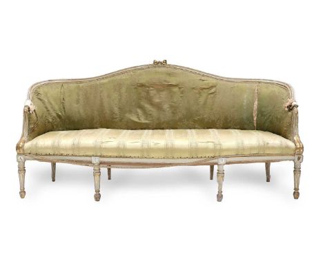 A Cream-Painted and Parcel-Gilt Three-Seater Sofa, 19th century, in the French Hepplewhite style, covered in worn cream flora