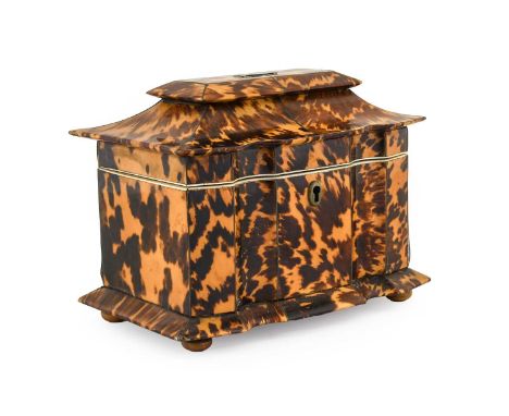 A Regency Tortoiseshell and Ivory-Banded Tea Caddy, of serpentine-fronted sarcophagus form, with hinged cover, flared base an