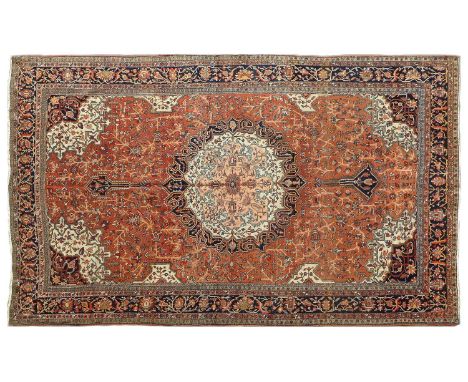 Feraghan Saroukh CarpetWest Iran, circa 1930The terracotta field of angular vines around an indigo, salmon pink and ivory med