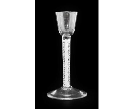 A Cordial Glass, circa 1750, the rounded funnel bowl on an opaque twist stem16cm highNo chips, cracks or re polishing. Some v