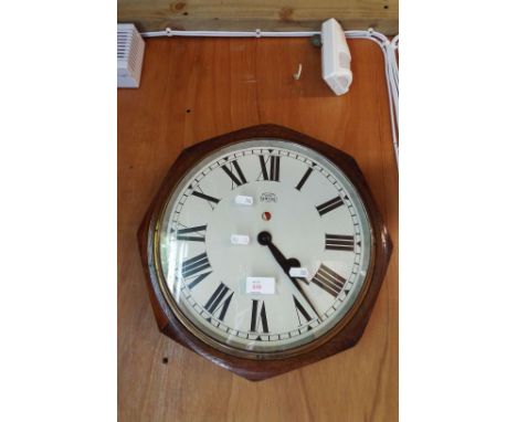 An octagonal oak cased Synclock electric clock