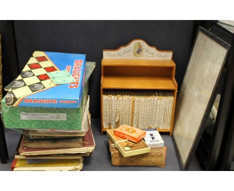 A Peter Rabbit book shelf complete with books; together with various games and books