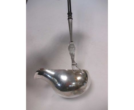 A Victorian shaped silver punch ladle with turned wood handle
