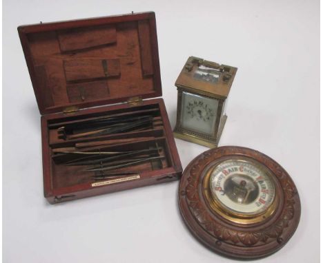 An Edwardian brass carriage clock, aneroid barometer and medical kit