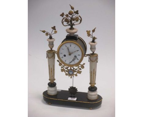 An early 18th century French alabaster and ormolu mounted clock, 47cm high