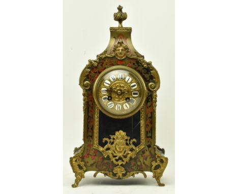 A French Continental 19th century boulle work &amp; ormolu eight-day movement mantle clock. The clock having a torch shaped f