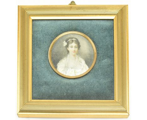 A 19th century English School miniature watercolour on ivory portrait of lady in white garments. The lady with floral head ba