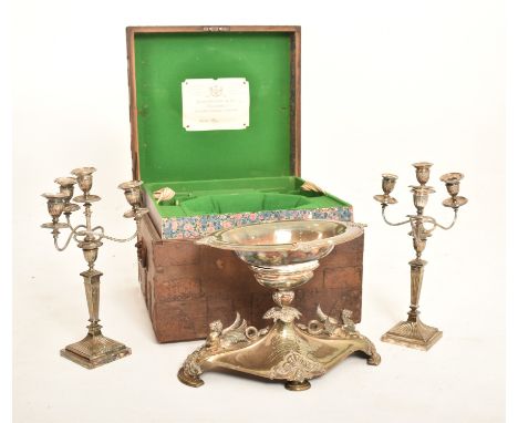 A late 19th century Victorian 1888 campaign chest containing Elkington & Co. presentation silver plated centrepiece and two c