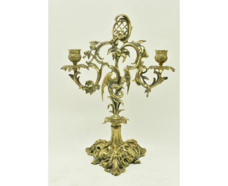 A French continental 19th century brass desk table twin arm candelabra candlestick holder. The candle holder having a reticul