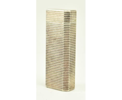 Cartier - A 20th century Cartier silver plated cigarette lighter having engine turned striped decoration to surface with cant