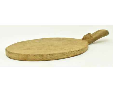 Robert 'Mouseman' Thompson - A 20th century oak cheese board of paddle form, with signature carved mouse to handle. Measures 