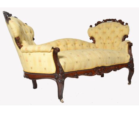 A 19th century Victorian mahogany double scroll end Chesterfield conversation sofa settee. Raised shaped reeded legs terminat