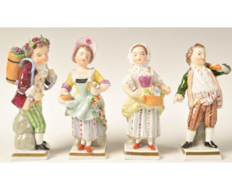 A collection of 4 19th century Sitzendorf porcelain figurines to include lady with basket, gentleman with flowers on back, va