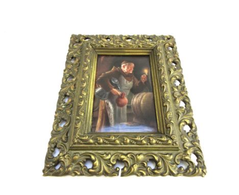 A small German rectangular porcelain plaque, early 20th century, painted with a monk in a beer cellar, holding a candlestick,