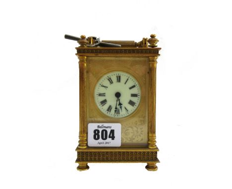 A gilt brass cased carriage clock, early 20th century, with white enamel dial and engraved plate, flanked by pillar supports 