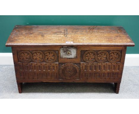 A 17th century oak five plank coffer with carved front panel, 101cm wide x 40cm deep.