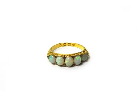 A Victorian 18ct gold, opal and rose diamond set five stone ring, mounted with a row of five graduated opals and with rose di