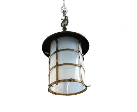 An Arts and Crafts style copper and brass lantern, early 20th century, with opaque glass circular shade, 40cm high.