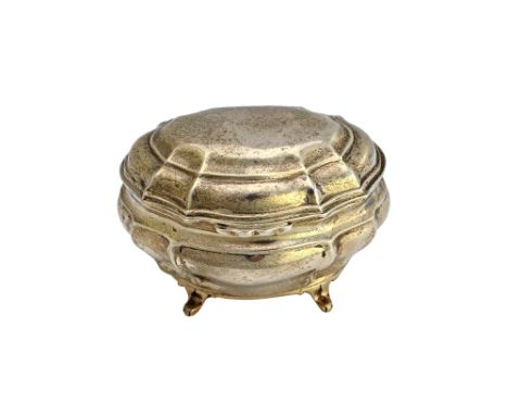 A silver late Victorian hinge lidded tea caddy, of shaped oval bombe rococo form, raised on four feet, London 1900, weight 24