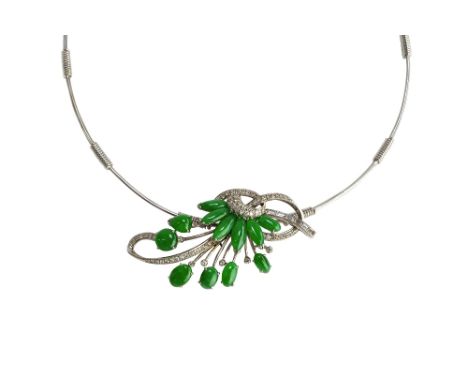 A white gold, cabochon, jade and diamond necklace, the front in an entwined and scrolling design, mounted with baguette and c