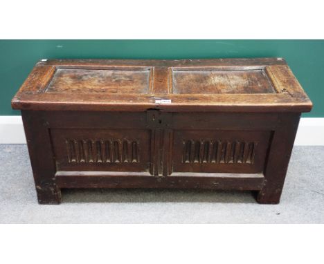 A small 17th century oak coffer, with double panel lid and front, on stile feet, 100cm wide x 40cm deep.