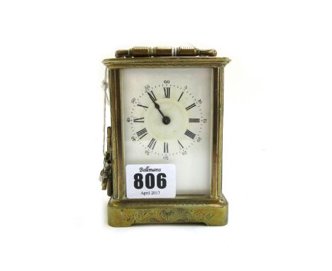 A French brass cased carriage clock, late 19th century, with foliate engraved case, visible escapement and a single train mov