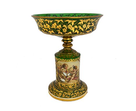 A Bohemian green glass and gilt foliate decorated comport, 19th century, with enamel cartouche to the stem, painted with putt