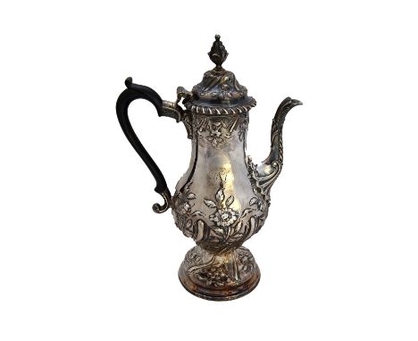 A George III silver coffee pot, of baluster form, with floral and fluted decoration and with a bud finial to the hinged cover