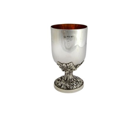A Victorian silver goblet, the stem supporting the cup cast with foliate and budding motifs, on a circular foot, London 1858,