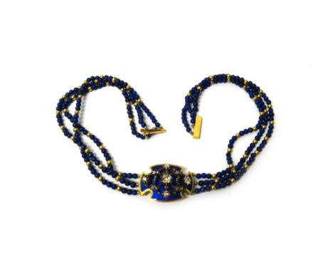 A gold, rose diamond, blue enamelled and lapis lazuli bead necklace, the front curved cruciform panel with a rose diamond set