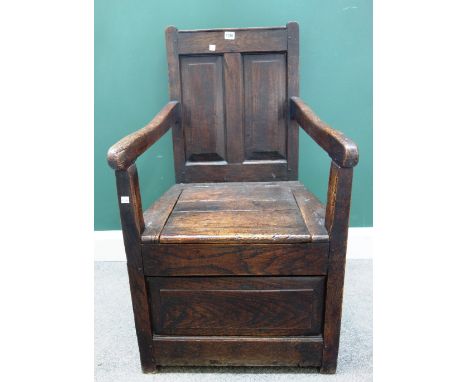 A George III oak box seat panel back open armchair, 56cm wide x 97cm high. 