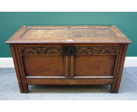 A 17th century oak coffer, with double panel lid and front on stile feet, 107cm wide x 51cm deep.