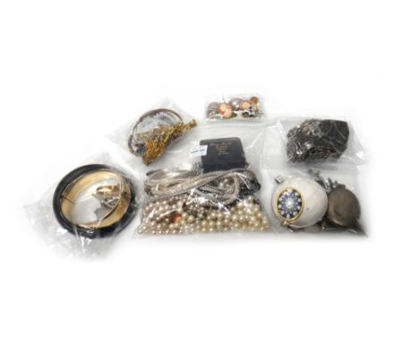 A filigree bracelet, having a coral clasp, a carved mother of pearl cameo panel link bracelet, with a box, four further brace
