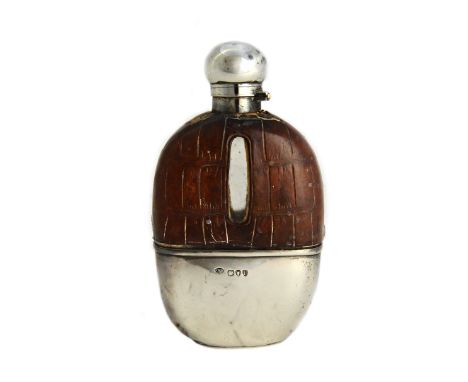 A Victorian silver mounted and partly leather covered glass spirit flask, of ovoid form, the pull-off beaker base London 1895