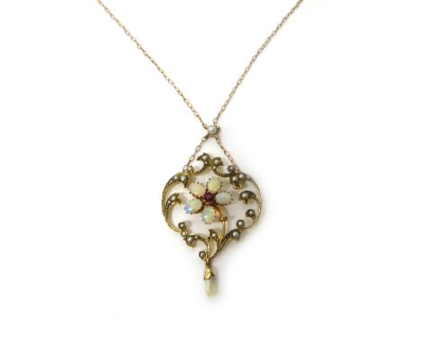 A gold, opal, ruby and seed pearl set pendant necklace, with a cinquefoil motif at the centre, within a scroll pierced surrou