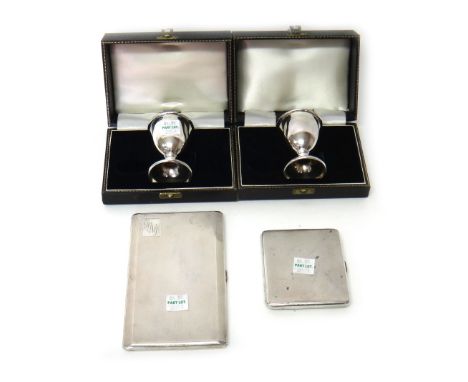 Silver comprising; two egg cups, Birmingham 1957 and 1958, with individual cases, (both lacking spoons), a rectangular cigare