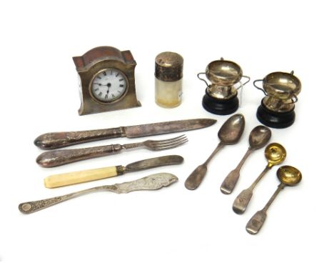 Silver and silver mounted wares, comprising; a small oak clock, a smelling salts bottle, two three handled trophies, Sheffiel