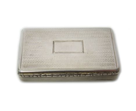 A silver rectangular hinge lidded snuff box, gilt within, the exterior engine turned, with reeded sides and with a moulded th