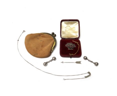 A rose diamond set jabot pin, designed as an arrow, a marcasite and cabochon red paste set brooch, designed as a basket of fl