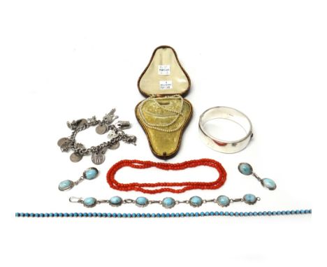 A single row necklace of coral beads, a single row necklace of imitation pearls, with a case, a silver oval hinged bangle, wi