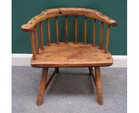 A George III West Country stick back chair, with three piece rail and solid seat on staked supports, 63cm wide x 65cm high. 