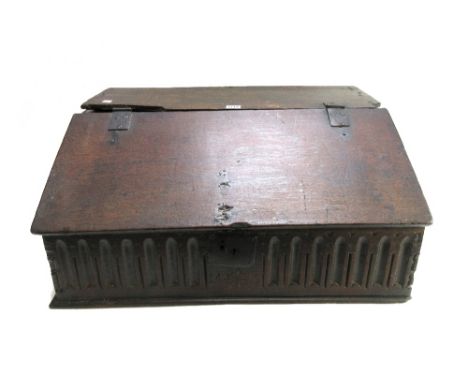 A 17th century oak slope front bible box with carved front panel, 66cm wide x 47cm deep.