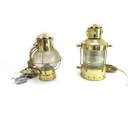 A set of five modern brass ship's wall lights of Victorian oil lamp design, the brass hood and open cage body enclosing a glo